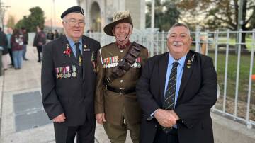 Ex-servicemen and members of the Bega RSL Sub-branch, Ken Pritchard, Mick Symon, and Gary 'Wombat' Berman at the Bega War Memorial. Picture by James Parker