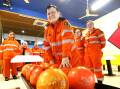 SES volunteer Allana Byrne, joined by other SES members at Shoalhaven City Lanes. Picture by Glenn Ellard