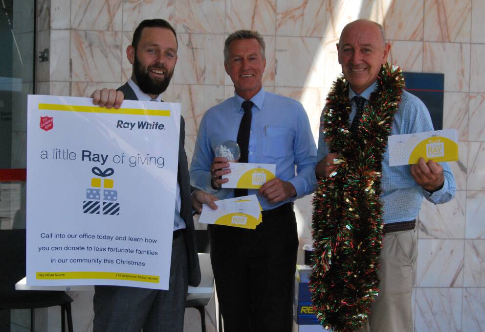 Ray White Real Estate Nowra's Glenn Brandon, Neil Weatherill and Graeme Dudgeon in Junction Street promoting their annual Christmas event 'A little Ray of giving'. 