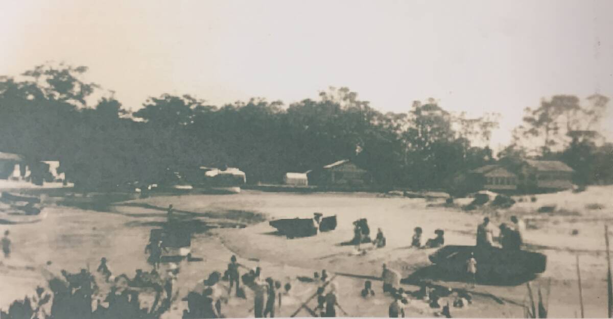 SURROUNDED: This photograph taken on the 1960s shows how close bushland was to houses on Currarong Creek. Photo: Shoalhaven Historical Society.