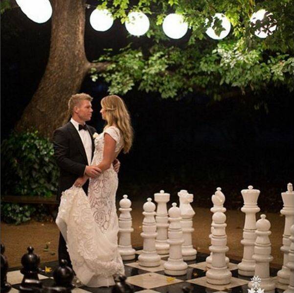 Candice and David Warner photographed on the giant chess board at Terrara House. Photo: Candywarner1/Instagram.
