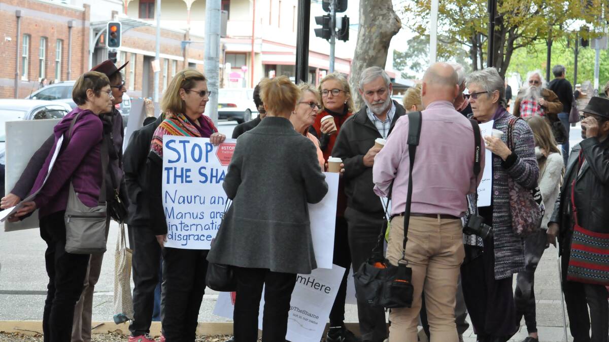 PROTESTING: The group held a rally outside the office of Ann Sudmalis, Federal Member for Gilmore.

