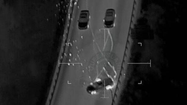 After its tyres were damaged by stingers, the driver lost control of the car several times before crashing into a barrier and fleeing on foot. Photo: Queensland Police Service (Supplied)