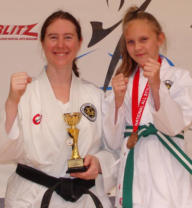 Girl power: Amanda Baker and Evie Rowe were delighted with their efforts at the recent National All Styles NSW State Karate Titles. 
