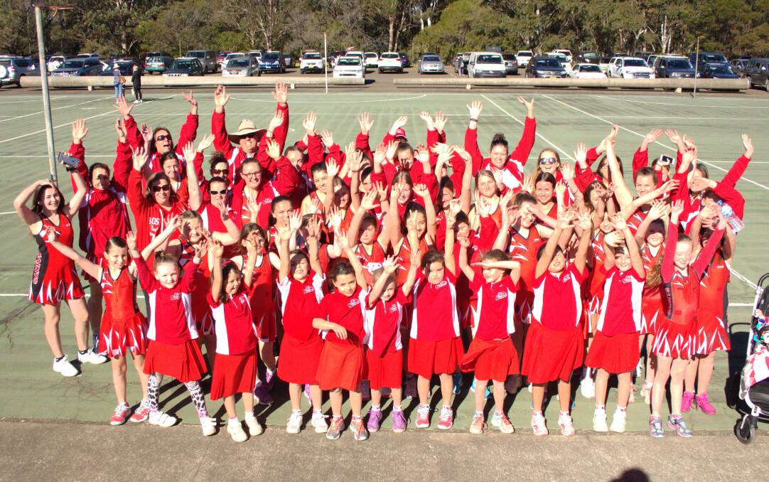 Reason to celebrate: Saints Netball Club members send out a cheer as the club marks 30 years since its inception.