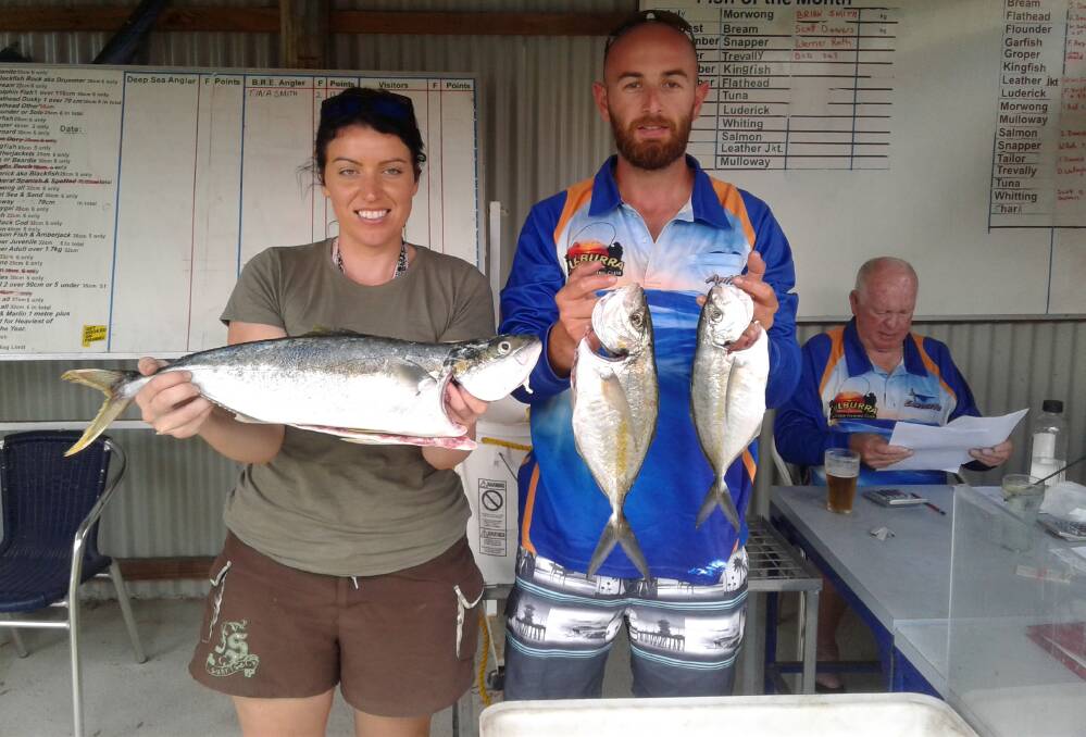 Good day's work: Joelene and Anthony with a kingfish and trevally.