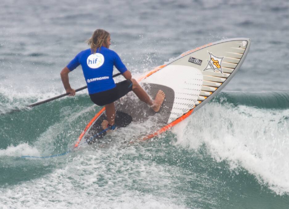 Time to stand up: Michael Stokes competes in a recent SUP surfing event. The state tiles are on in the Shoalhaven on April 28-30. Photo: Ethan Smith (Surfing NSW)