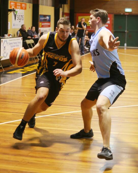 ON THE ATTACK: Shoalhaven Tigers' William Ozolins drives towards the basket in Saturday's loss to Sutherland. Photo: ROBERT CRAWFORD