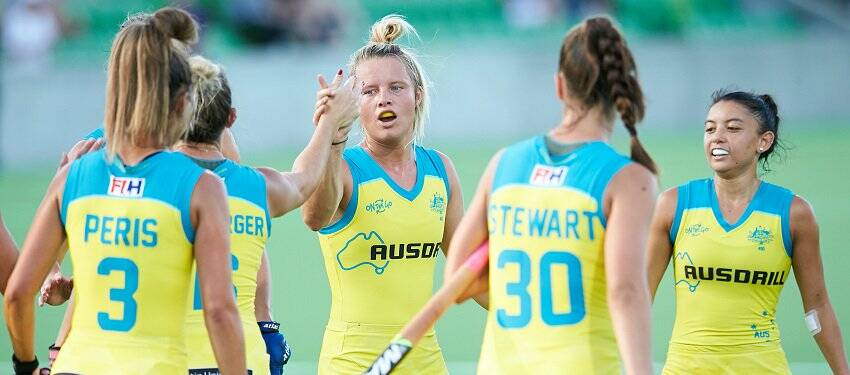 Grace Stewart (30) and her Hockeyroos team mates celebrate a goal against China PR. Photo: HOCKEY AUSTRALIA