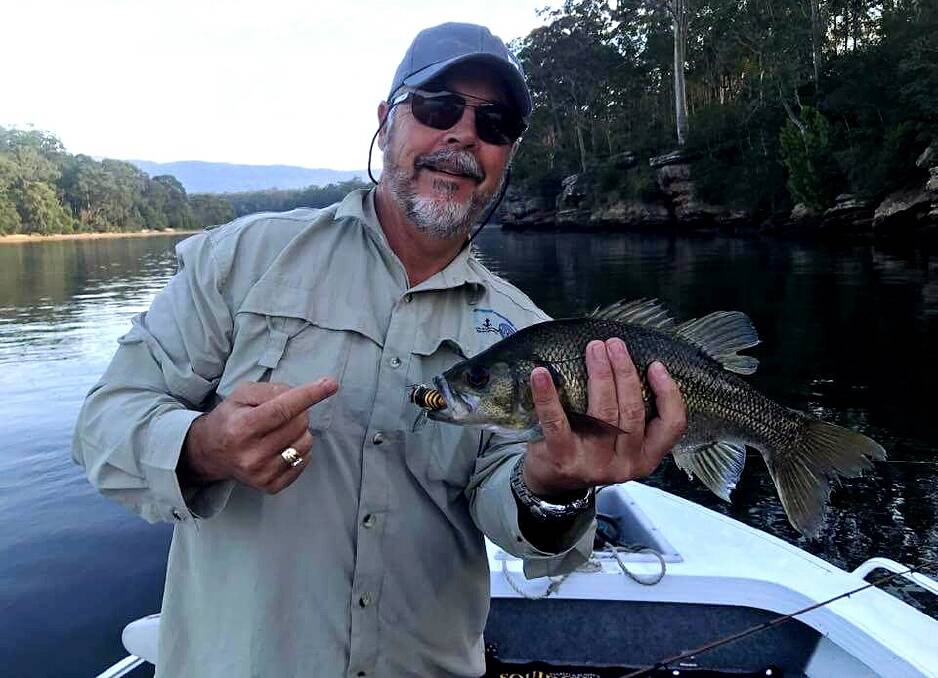 LOOK WHAT I CAUGHT: Outback Rod's Mark Fisher shows off a nice Shoalhaven River bass, taken on a bumblebee cicada surface lure.