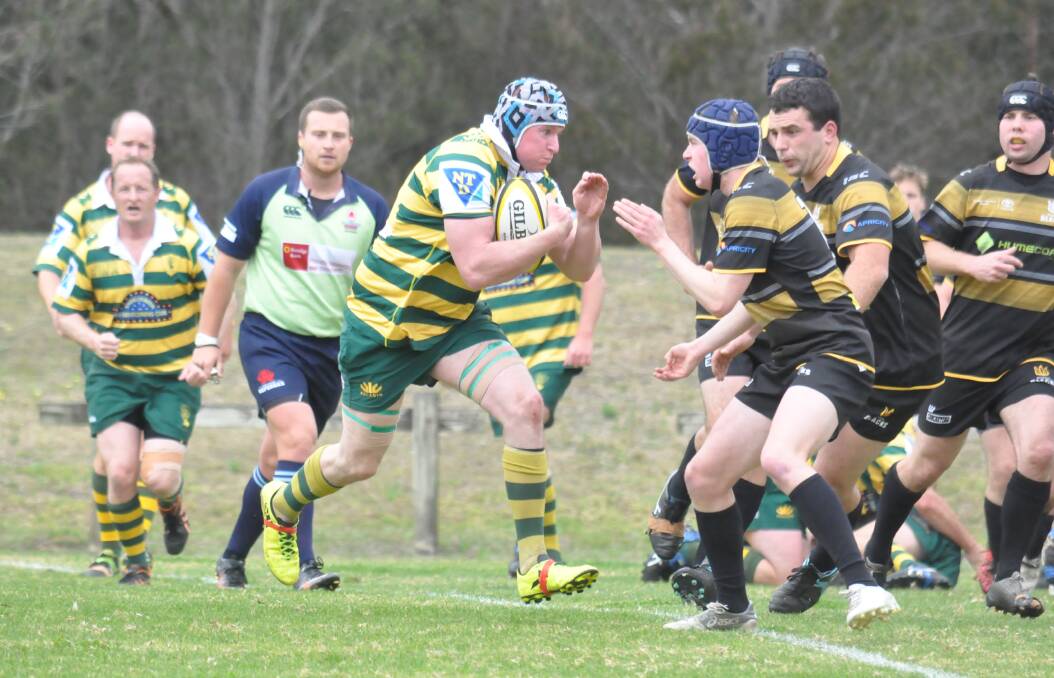 Taking them on: Shoals' Richard Murphy heads into the Bowral defence. In a brutal game with the sides going hammer and tong, Shoals prevailed 13-5.  Photo: DAMIAN McGILL