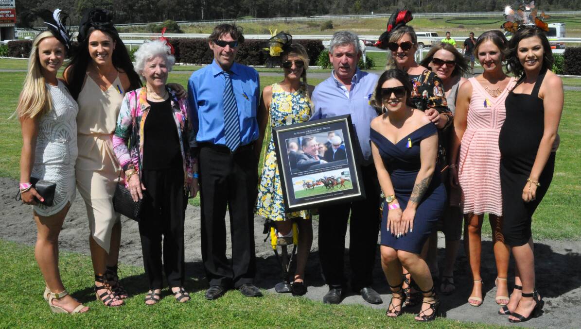 HONOUR: The Murray family pose with a photo of the plaque presented to them by the Shoalhaven City Turf Club on Sunday. Photo: COURTNEY WARD