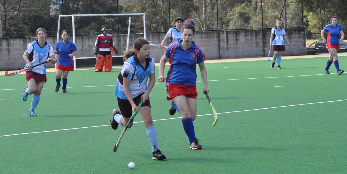 ON ATTACK: Shoalhaven Heads' Jamie Griffen looks for a pass during Sunday's grand final against Burrawang at the Shoalhaven Regional Hockey Complex. Photo: COURTNEY WARD