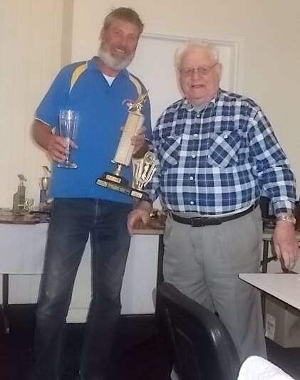 WELL DONE: Champion of champions Glenn Drady is given his award by Jack Price at the recent Archer Fishing Club 2016/17 season presentation.