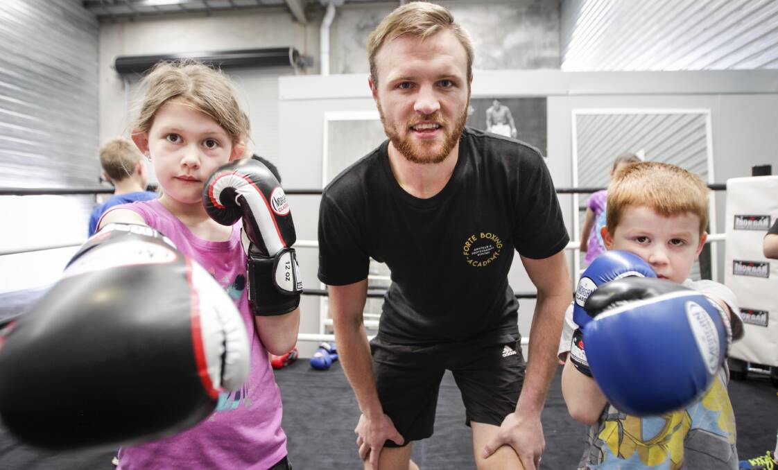 GLOVES UP: Mark Lucas has been showing local kids how sport and especially boxing can have a positive effect on your life. Photo: GEORGIA MATTS