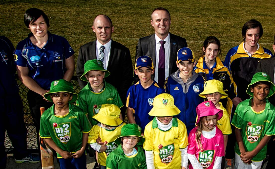 Cricket ACT chief executive Cameron French (middle with tartan tie) says wides and no balls will no longer be the highest scorer in junior cricket.
