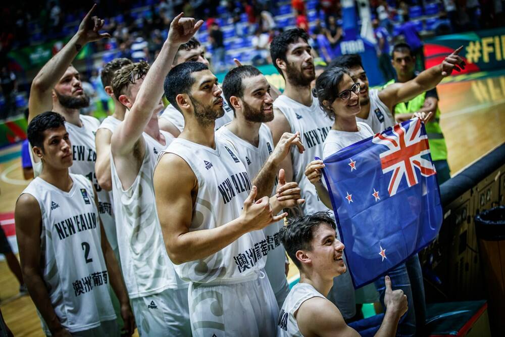 New Zealand after the win, with James Hunter at the back. Photo: FIBA