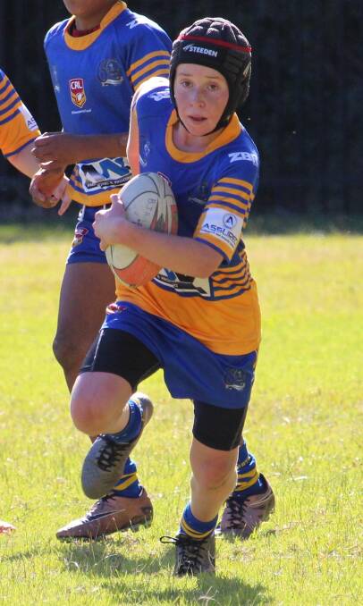 DETERMINED: Toby Scotcher was one of the many players who contributed to a massive 30-12 win by the Swamprats' under 12s.