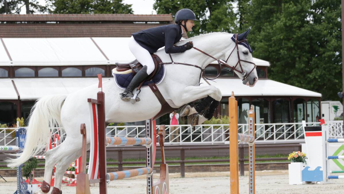 POISE AND BALANCE: Jamie Priestley attempts a jump with her horse cider, while competing recently in France.