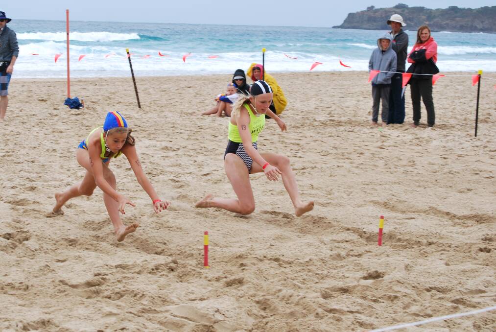 SAND STAR: Mollymook SLSC's Karla Jones races to claim a flag during the under 13s female event, at round two of the Sydney Water Surf Series at the weekend. Photo: HAYLEY WARDEN