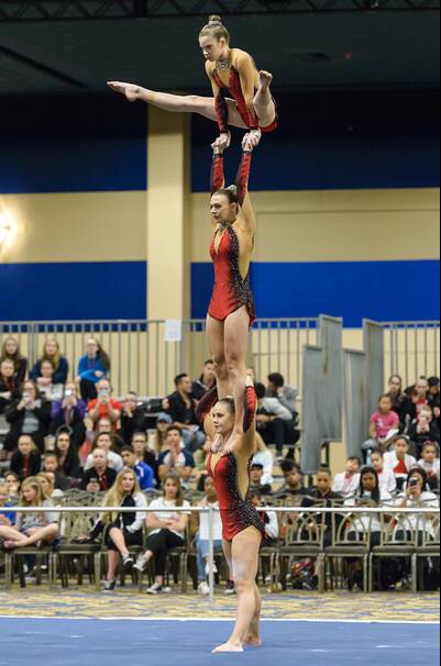 COHESION: Lauren Farquhar (bottom), Taylah Doosey (middle) and Maja Moore (top) will compete at the Acrobatic Gymnastics World Age Group Competitions.