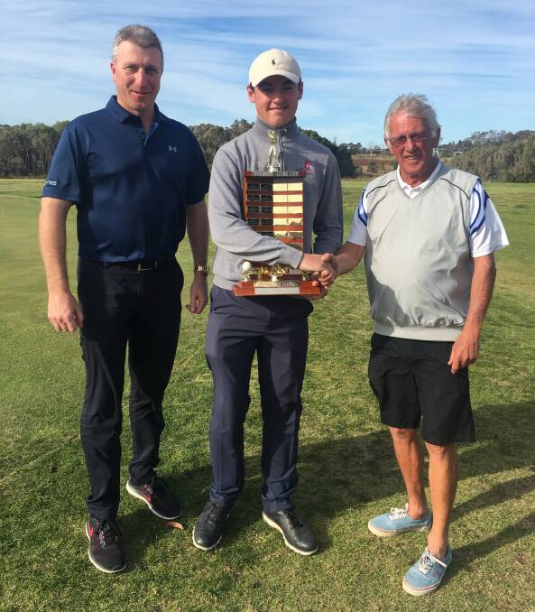 Luke Taylor from Gerringong, who won the Worrigee Links Open last Saturday, is presented with his trophy by Ex-Servos CEO Bernie Brown and Captain Brian Dwyer. 