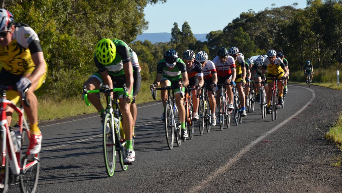 Close racing: Phil Rice and Adam Rourke lead the bunch in the Nowra Velo Club Optus series race on Sunday.