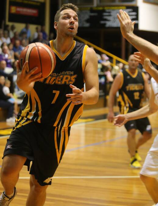 GETTING BUCKETS: Shoalhaven Tigers' William Ozolins top-scored for his team on Saturday against Canberra with 16 points. Photo: ROBERT CRAWFORD