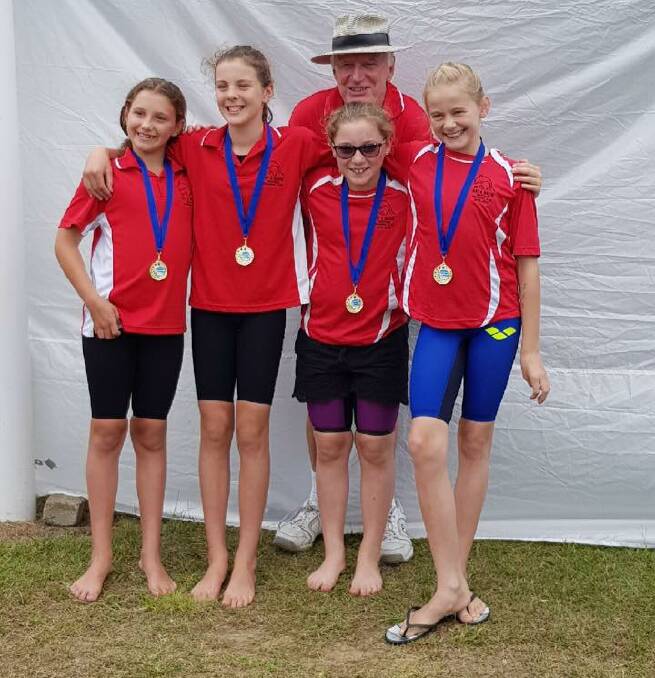 Bay and Basin's junior relay team who came 1st at SESA Championships are Makynli Dale, Laylah Connelly, Charlotte Greenwood and Talika Irvine with coach Bob McEvoy. 