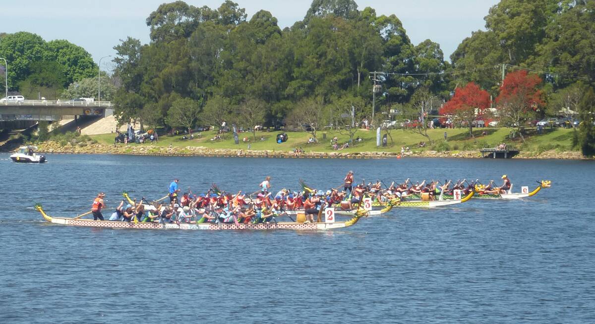 Community fun and fitness: Sports teams battle it out in heat 2 of last year's community regatta on the Shoalhaven.