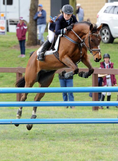 LETHAL COMBINATION: Kangaroo Valley's Aria Baker and her horse Stellar during a competition 2016 which led her to winning the NSW primary showjumping champion award. Photo: OZSHOTS