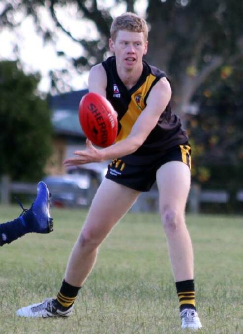 CLINICAL: Bomaderry's Tom Hines gets a handball away. Photo: CATHY RUSSELL