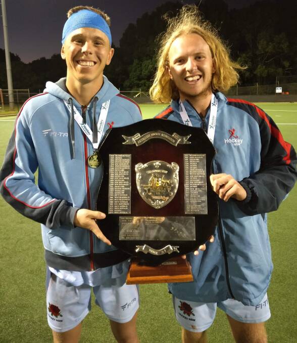 NATIONAL CHAMPIONS: New South Wales team mates Callum Mackay and Tom Dolby with the under 21s men's Australian Championships trophy. Photo: MICHAEL DOLBY