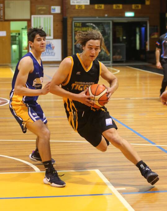 ATTACKING THE BASKET: Shoalhaven Tigers' Bruce Ozolins top-scored for his side, with 23 points, in their quarter-final loss to the Canberra Gunners, at the Belconnen Basketball Stadium. Photo: ROBERT CRAWFORD