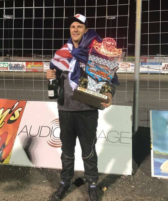 STOKED: Shoalhaven Heads' Glen Arnold and his prize for winning his division at the Red River Valley Speedway in North Dakota, United States.