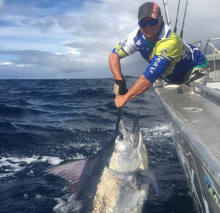 YEW BEAUTY: Andy Clark is all smiles after landing a marlin on a recent fishing adventure in the Shoalhaven. All three types of marlin are out and about at the moment, so now is the time to land this bucketlist fish.
