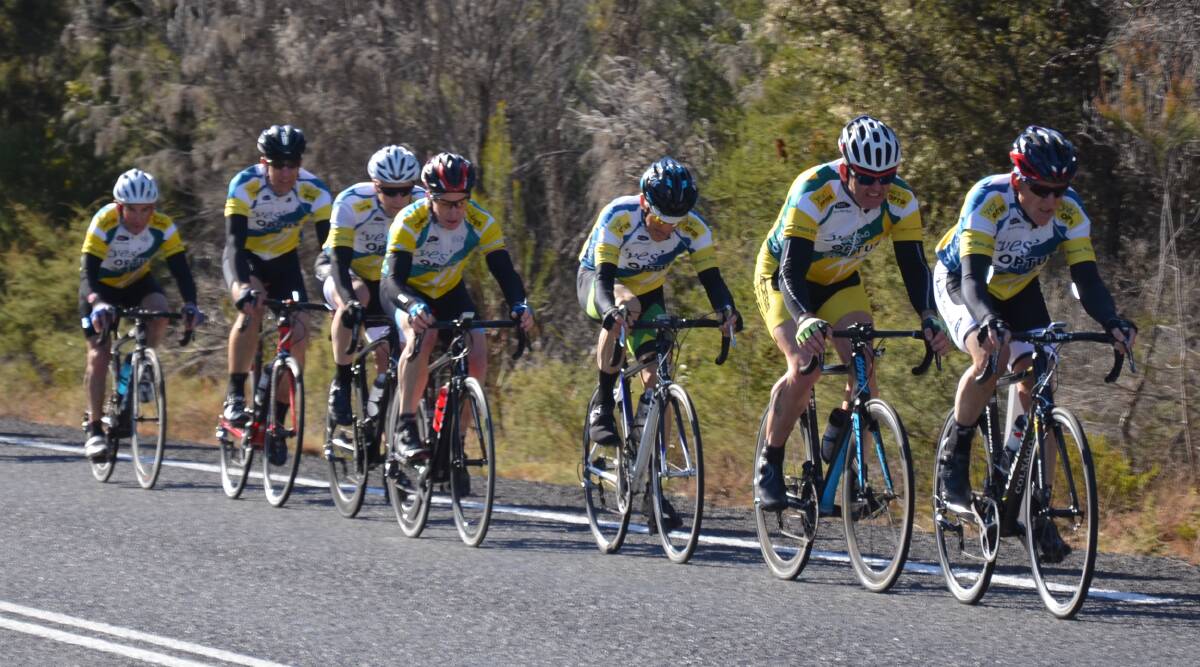  Leader of the pack: Gary Bryce leads Brad Oaten and the field in the C grade event at the Nowra Velo Club road championships on Braidwood Road on Sunday.