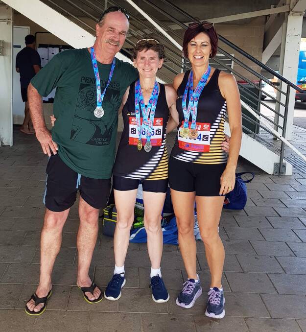 Great efforts: Nowra Athletics Club's Bill Pomplun, Cristine Suffolk and Alissa Beresford show off their medals at the NSW Masters Championships in Sydney.