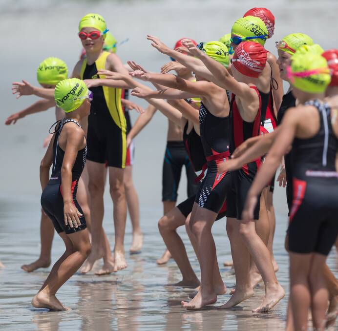 Ready to go: Youngsters full of excitement just before the start of the Miniman swim last year. The Miniman triathlon for kids aged 7-11 is a crowd favourite. Photo: Craig Parker