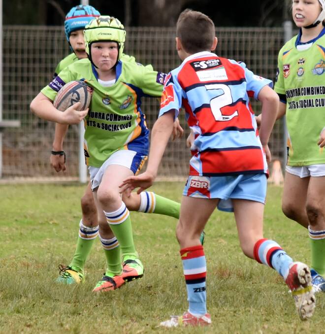 Out of my way!: Culburra Dolphins' Carter Britton was named Man of the Match in the Under 9s' 32-26 win over Milton Ulladulla at the weekend. Photo: JAKKI HAYDOCK