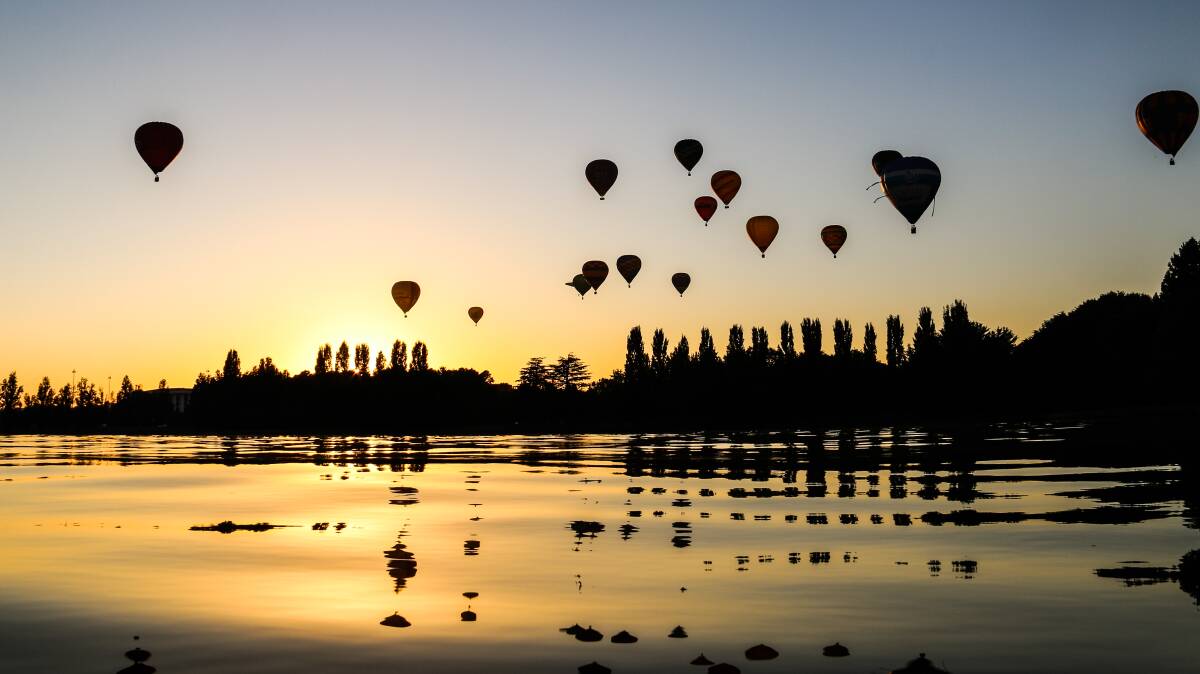 Watching the hot air balloons take flight is a glorious start to the day at Old Parliament House Lawns from 6:15am.