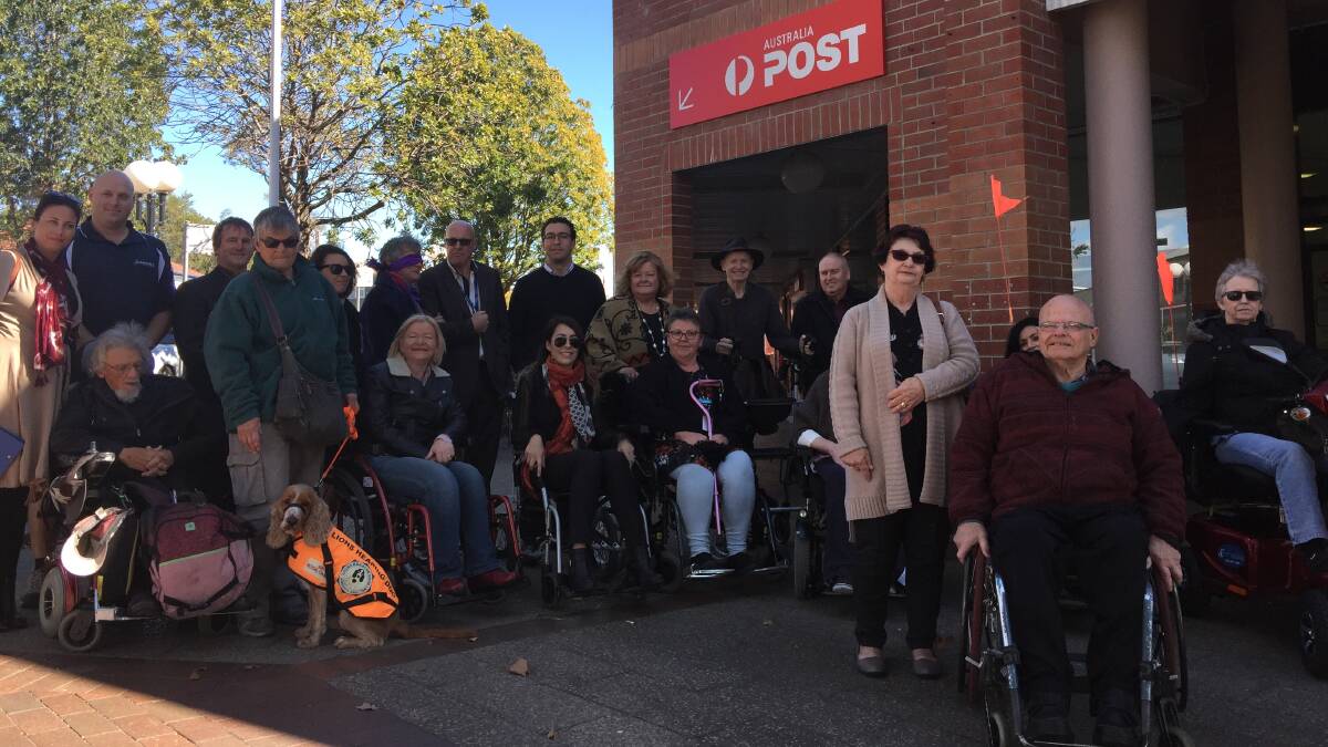 OBSTACLE COURSE: Councillors, staff and disabled residents tour Nowra's CBD on Monday during the launch of Shoalhaven City Council's Disability Inclusion Action Plan. 