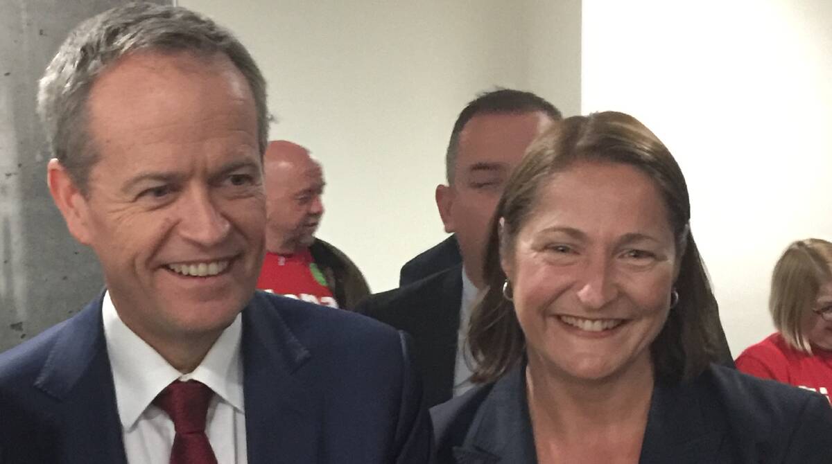 ALL SMILES: Opposition Leader Bill Shorten and the ALP's Gilmore candidate Fiona Phillips after the Labor Party meeting in Nowra on Tuesday night. 