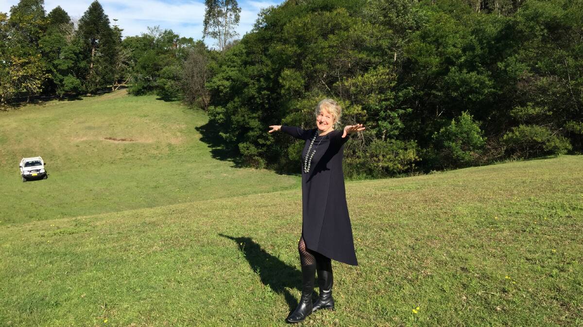 THE HILLS ARE ALIVE: Bundanon Trust chief executive officer Deborah Ely shows where the bridge structure will sit near Riversdale. Photo: John Hanscombe