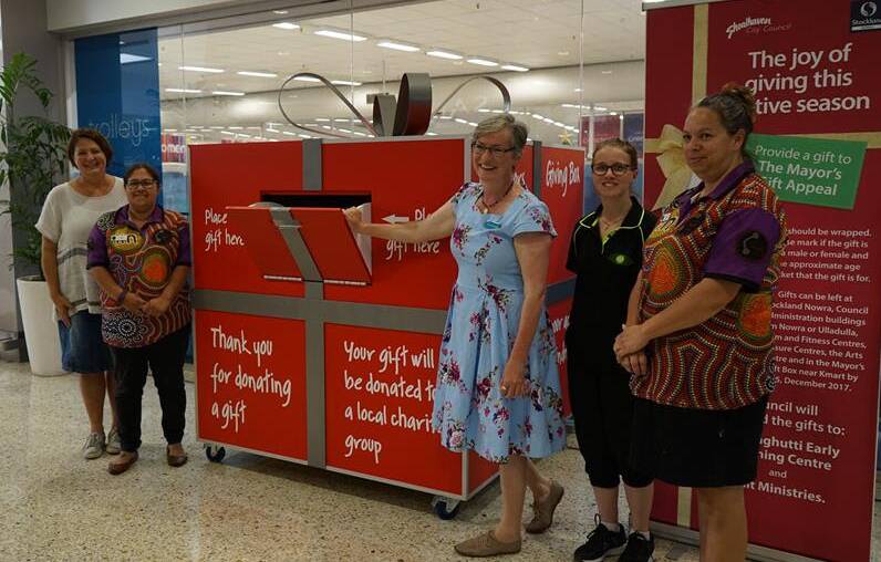 GENEROUS SPIRIT: Megan Dover and Tara Leslie join Shoalhaven Mayor Amanda Findley, Tina Seymour and Ash Hudson to launch the Giving Box at Stockland Nowra.
