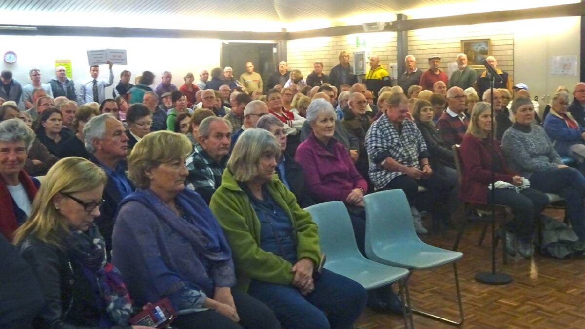 NOT HAPPY: St Georges Basin residents pack a community hall meeting in June to voice their opposition to the Anson Street unit development. 