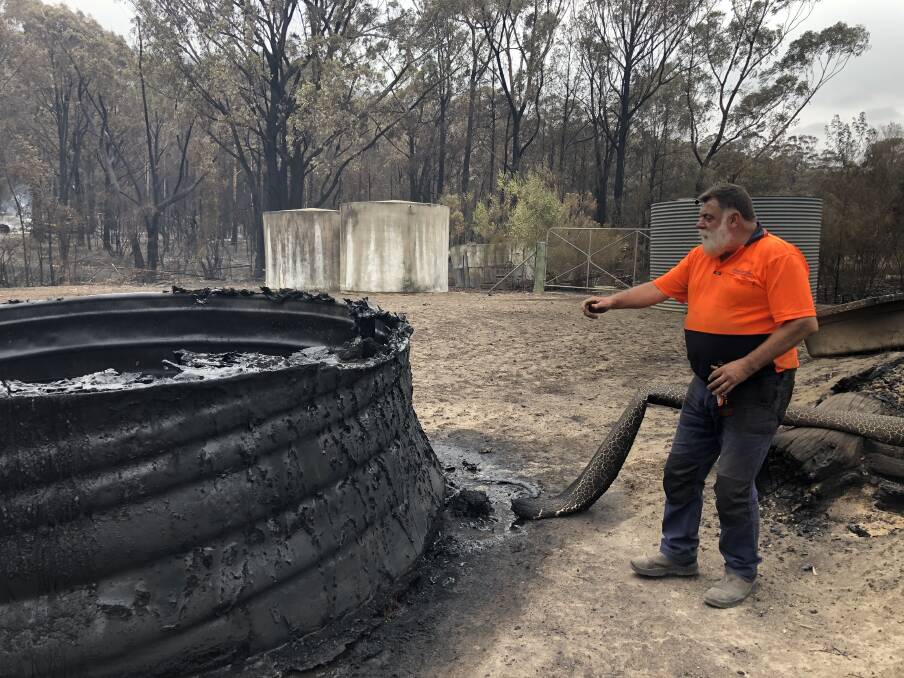 MOLTEN: Dave Bright watched as this water tank melted. Photo: John Hanscombe 