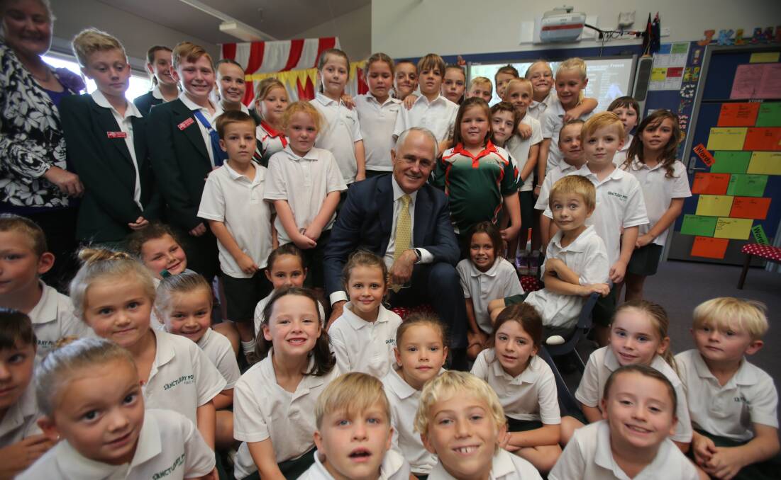 SCHOOL LEADER: Prime Minister Malcolm Turnbull mixes with students at Sanctuary Point Public School on Thursday. Photo: ROBERT PEET  