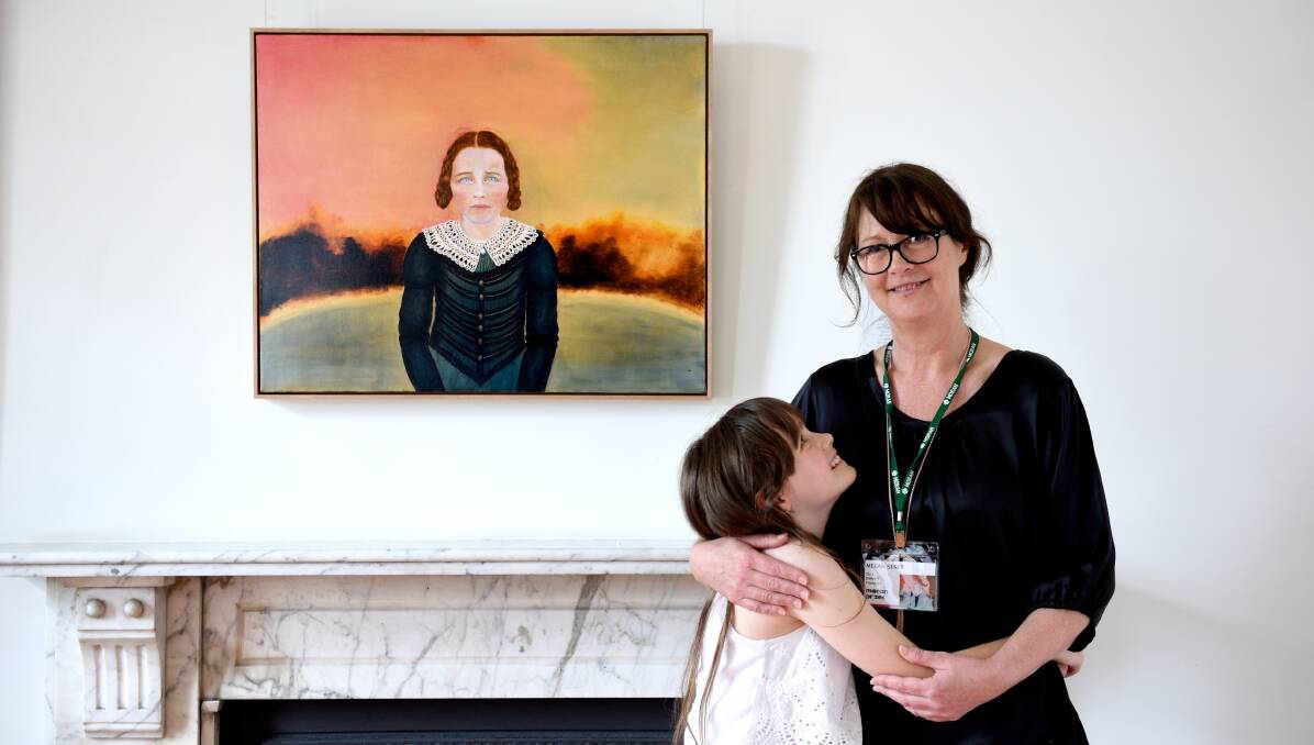 CONVICTION: Artist Megan Seles with her daughter Scarlett in front of her winning work Scarlett as Colonial Girl. Photo: Steven Siewert 