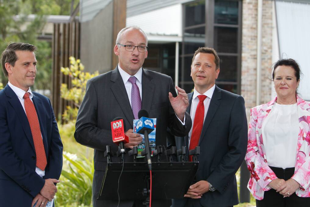 Paul Scully (second from right) listens as Labor leader Luke Foley unveils the party's jobs action plan for the Illawarra on Wednesday. Picture: Sylvia Liber